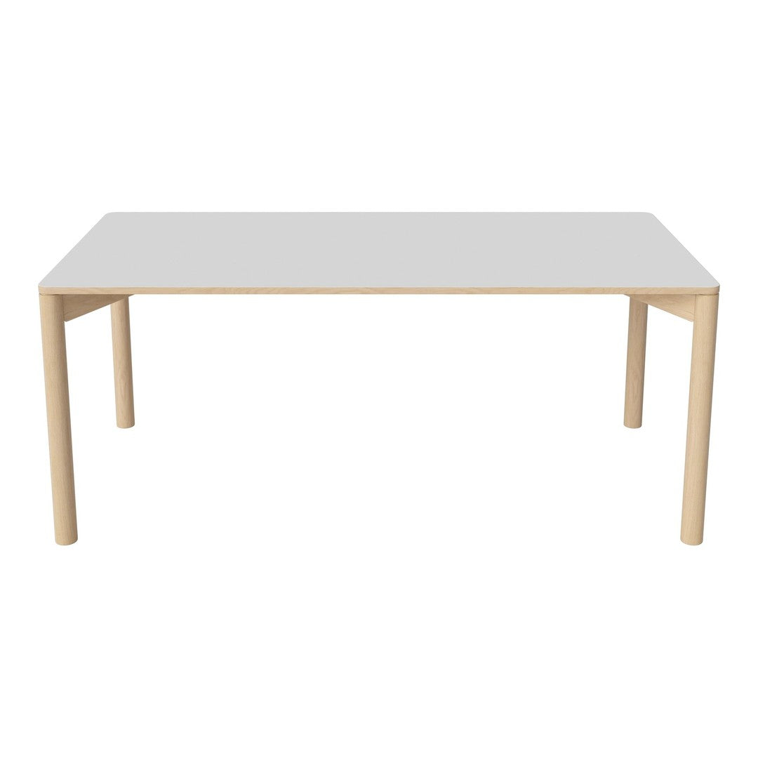 Modern rectangular table with a glossy white top and light wood legs, featuring a minimalist design and clean lines.