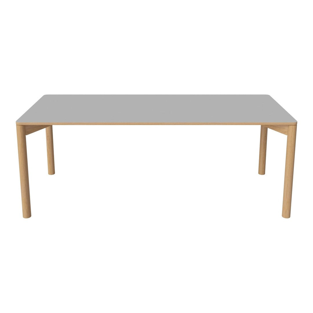 Modern rectangular table with a sleek gray top and natural wood legs. Minimalist design, perfect for contemporary spaces.
