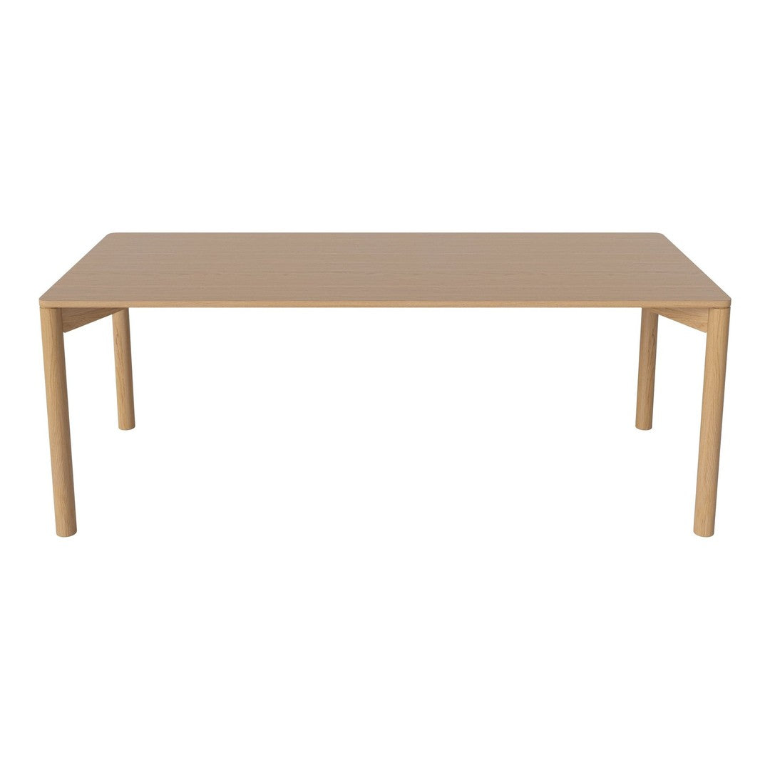 Light beige rectangular dining table with sleek, smooth surface and simple design, perfect for modern spaces.