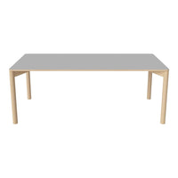 Gray tabletop with natural wooden legs, featuring a minimalist design and smooth surface. Perfect for modern decor.