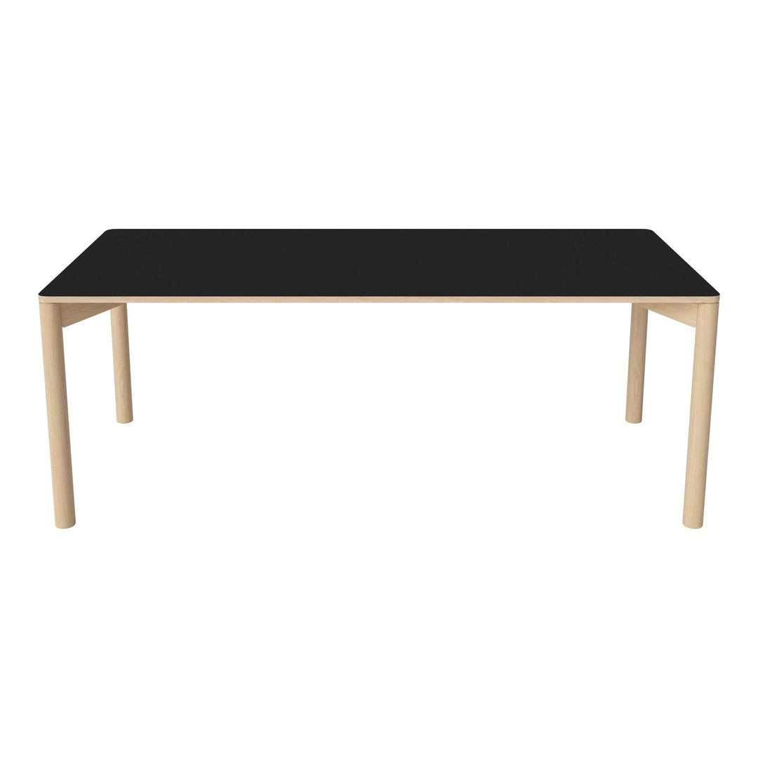 Black tabletop with natural wood legs; modern design complements various decor styles.