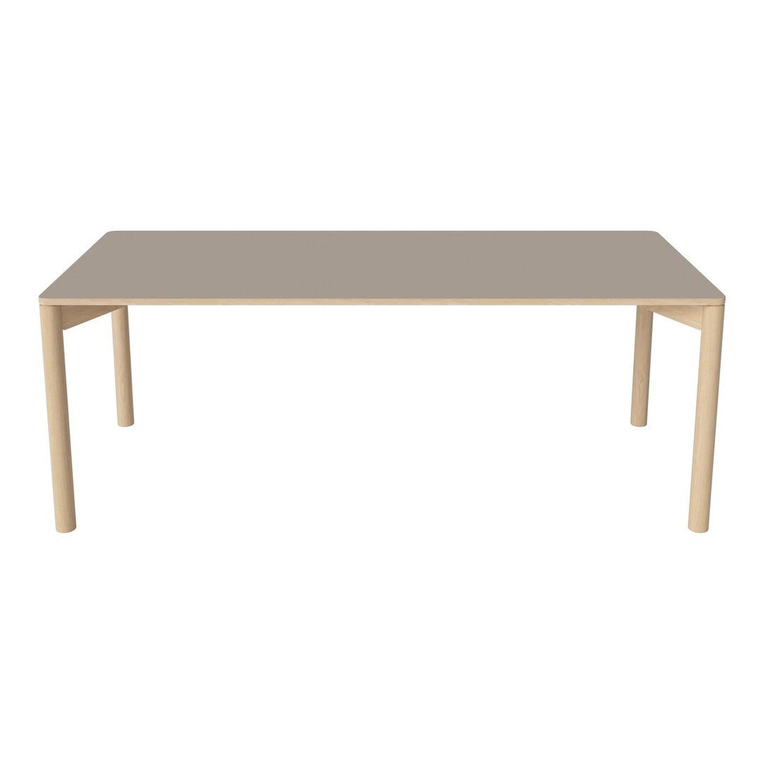 Modern beige rectangular table with sleek, minimalistic design and light wooden legs. Perfect for any dining space.