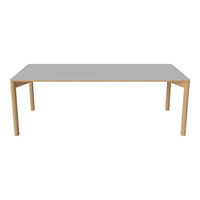 Gray tabletop with natural wood legs, featuring a sleek, modern design suitable for any contemporary setting.