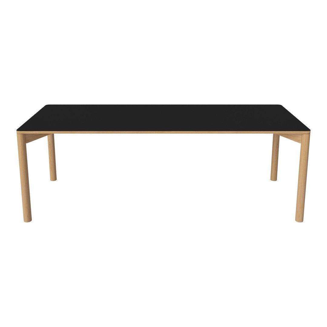 Black tabletop with natural wood legs, sleek modern design, perfect for contemporary dining spaces.