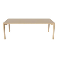 Beige rectangular table with sleek design and smooth surface, perfect for modern decor.