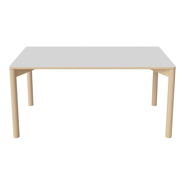 "Modern white table with natural wood legs, featuring a sleek, minimalist design and smooth surface."
