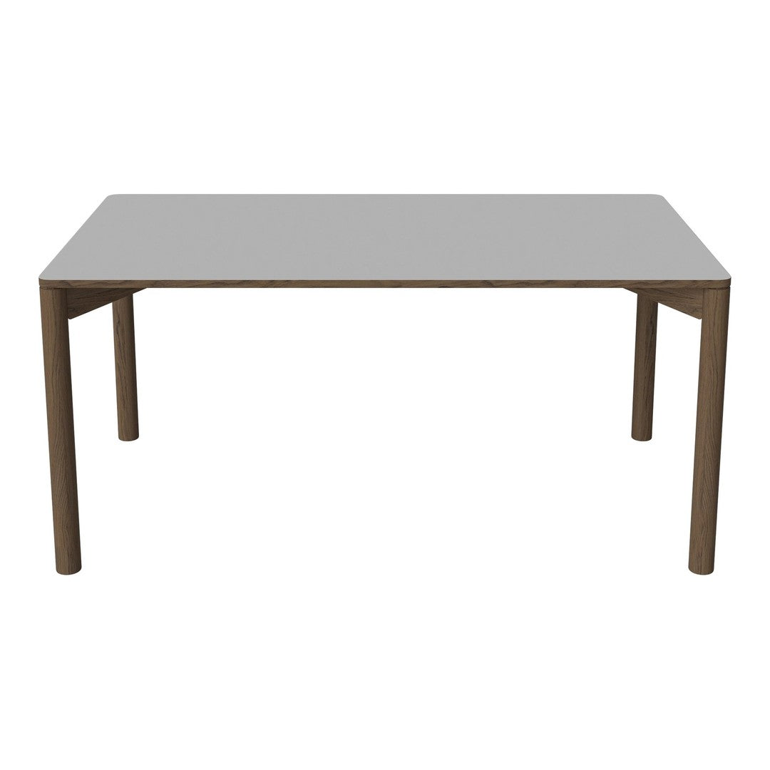 Rectangular table with a sleek gray surface and warm brown wooden legs, featuring a minimalist design.