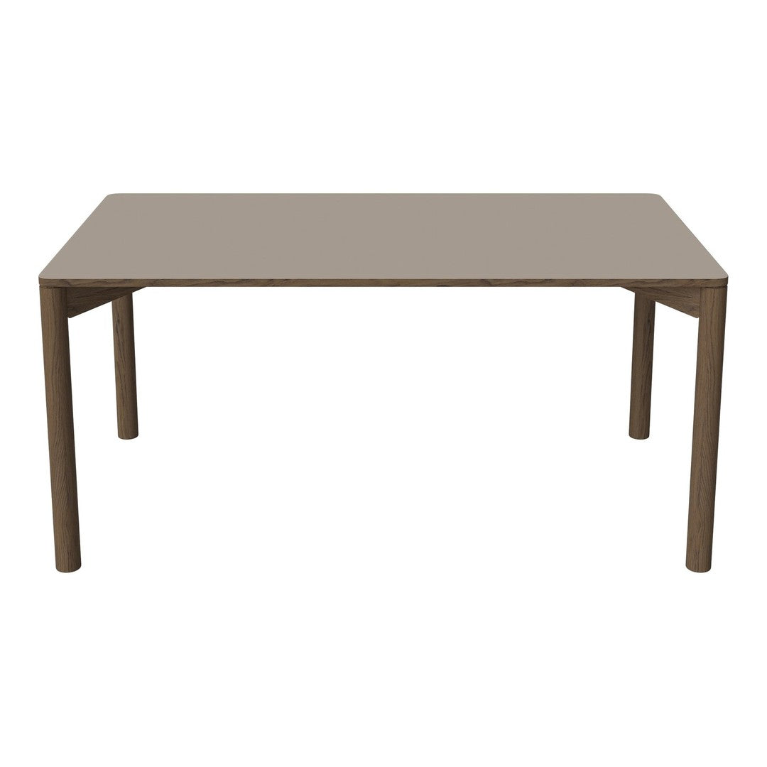 Neutral beige dining table with a smooth finish and simple, clean lines. Perfect for modern decor.