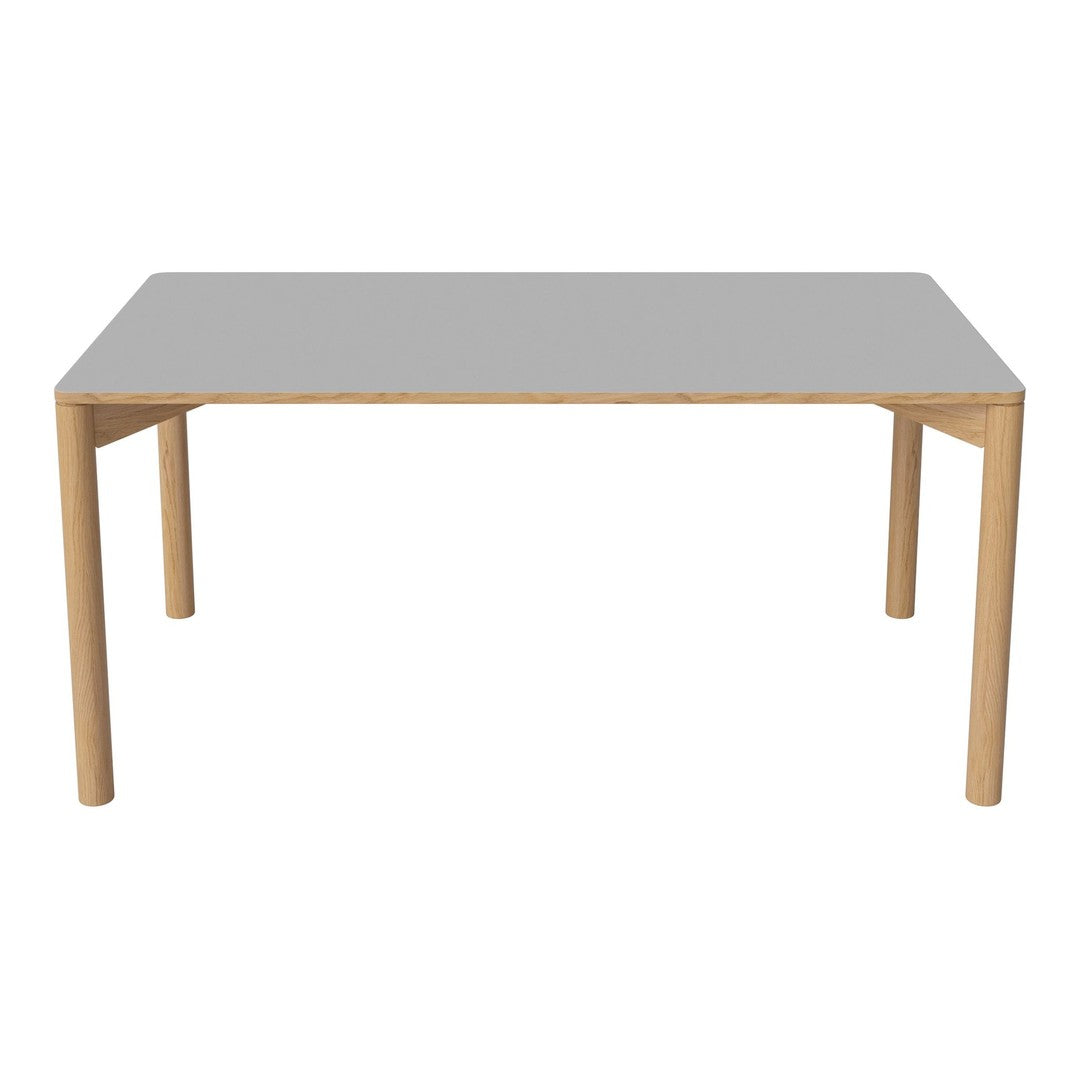 Modern rectangular table featuring a sleek gray top and natural wood legs, perfect for contemporary spaces.