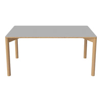 Modern rectangular table featuring a sleek gray top and natural wood legs, perfect for contemporary spaces.