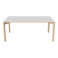 Minimalist white tabletop with natural wooden legs, featuring a sleek, modern design.