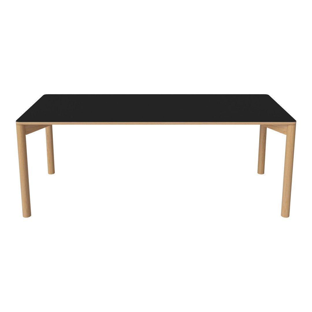 Sleek black tabletop with light wood legs, minimalist design, and modern aesthetic for contemporary dining spaces.