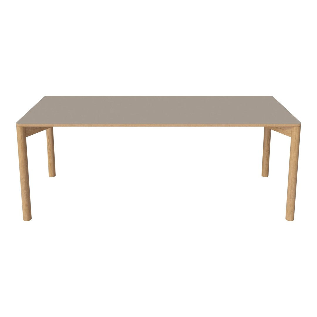 Light beige rectangular table with smooth surface and natural wood legs, perfect for modern dining spaces.