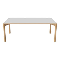 White tabletop with a smooth finish and natural wood legs. Simple, modern design perfect for any space.