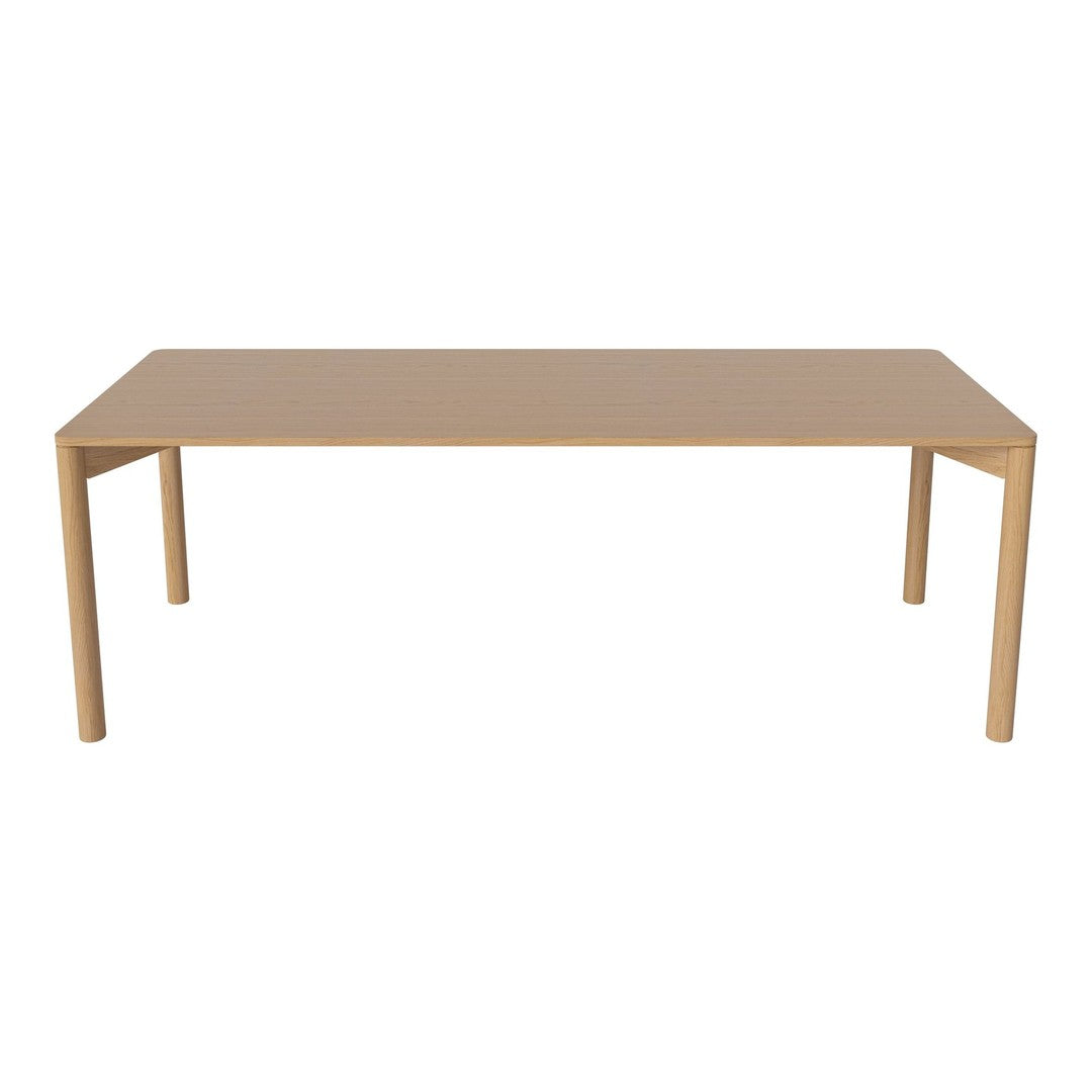 Plain beige dining table with smooth surface and clean lines, perfect for modern or minimalist decor.