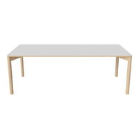 Modern white tabletop with natural wood legs, featuring a sleek, minimalist design for contemporary spaces.