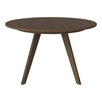 Round brown wooden table with a smooth finish and tapered legs, showcasing a minimalist design.