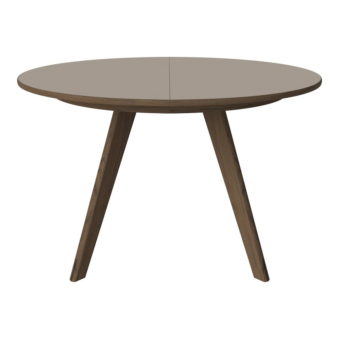 Round beige dining table with a smooth surface and tapered wooden legs, ideal for modern interior designs.