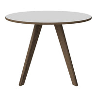 White round tabletop with natural wood legs, showcasing a modern, minimalist design. Perfect for any decor.