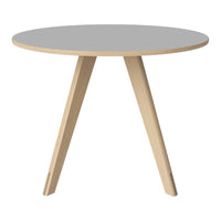 Round table with a sleek gray top and natural wood legs, featuring a minimalist design. Perfect for modern interiors.