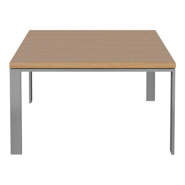 Light wood tabletop with a smooth finish and sleek silver metal legs. Simple, modern design, perfect for any decor.