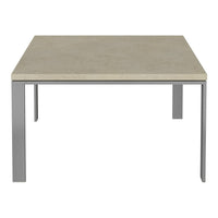 Square table featuring a light beige stone top and sleek silver metal legs. Minimalist design with subtle tones.