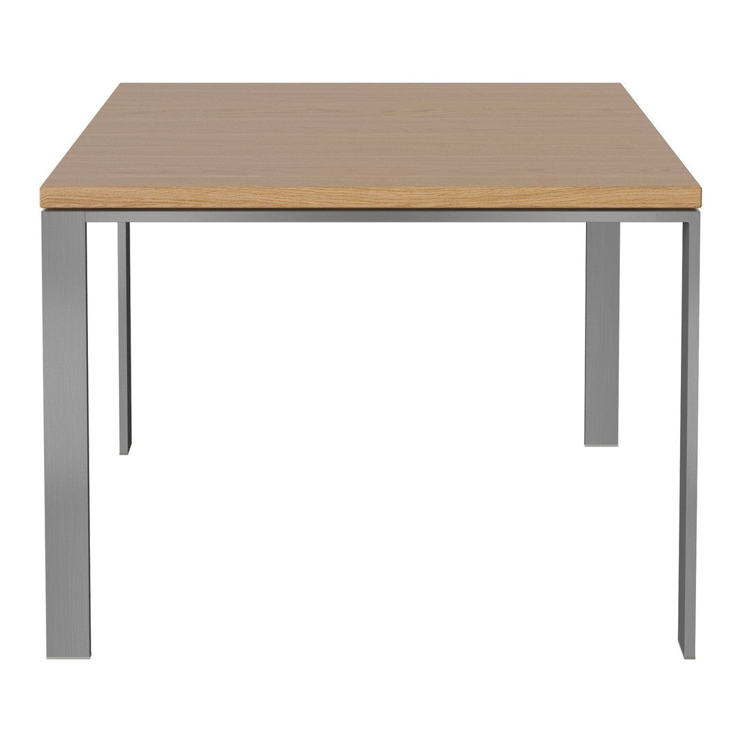 Light wood tabletop with smooth finish and sleek silver metal legs. Simple, modern design emphasizes minimalism.