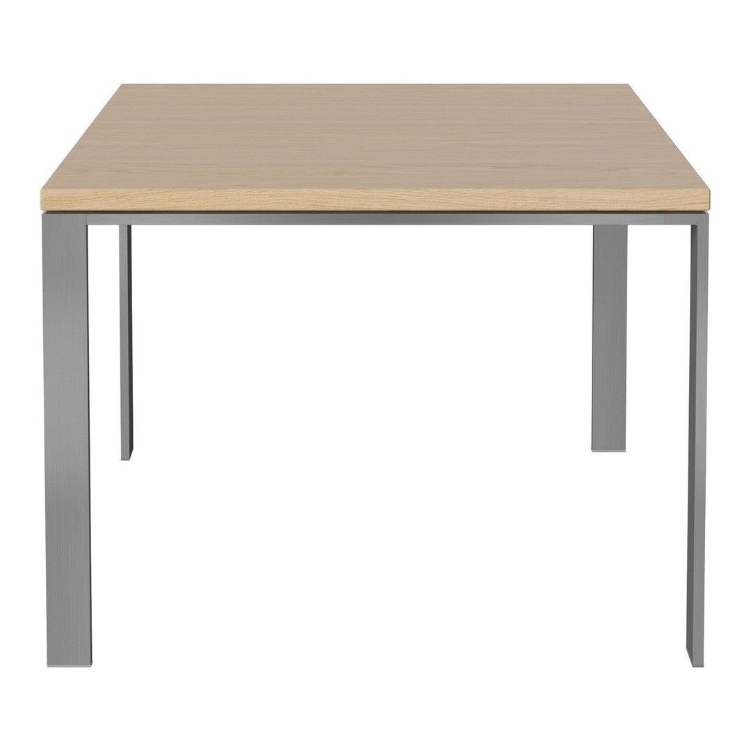 Light wooden tabletop with a smooth finish and sleek silver metal legs, creating a modern, minimalist design.