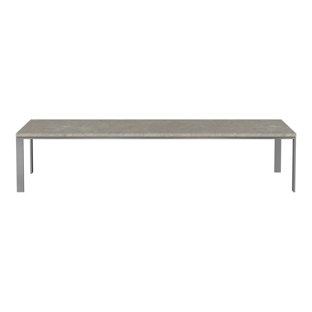 Gray concrete tabletop with a smooth finish and sleek silver metal legs, perfect for modern decor.