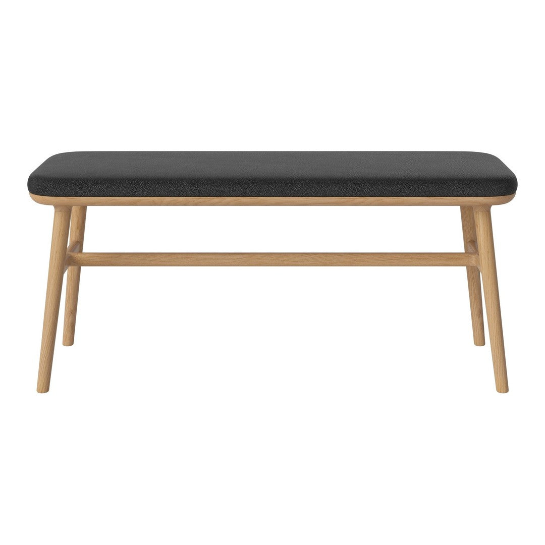 Black cushioned bench with natural wood legs, featuring a minimalist design and clean lines. Perfect for modern decor.