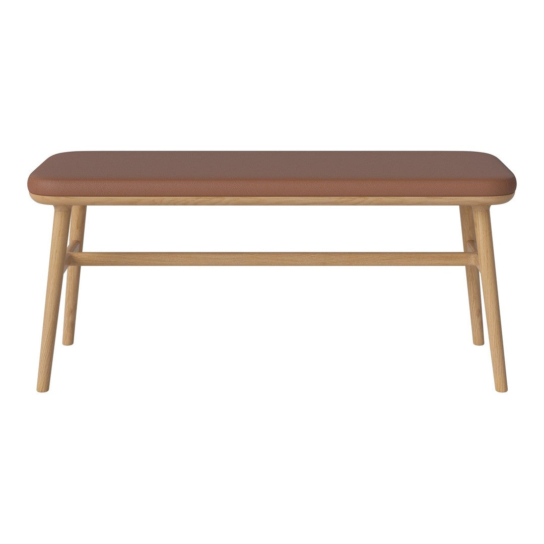 Brown rectangular tabletop with rounded edges, supported by light wooden legs. Simple, modern design.