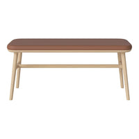 Brown top with a smooth finish and light wooden legs, featuring a minimalist design perfect for modern decor.