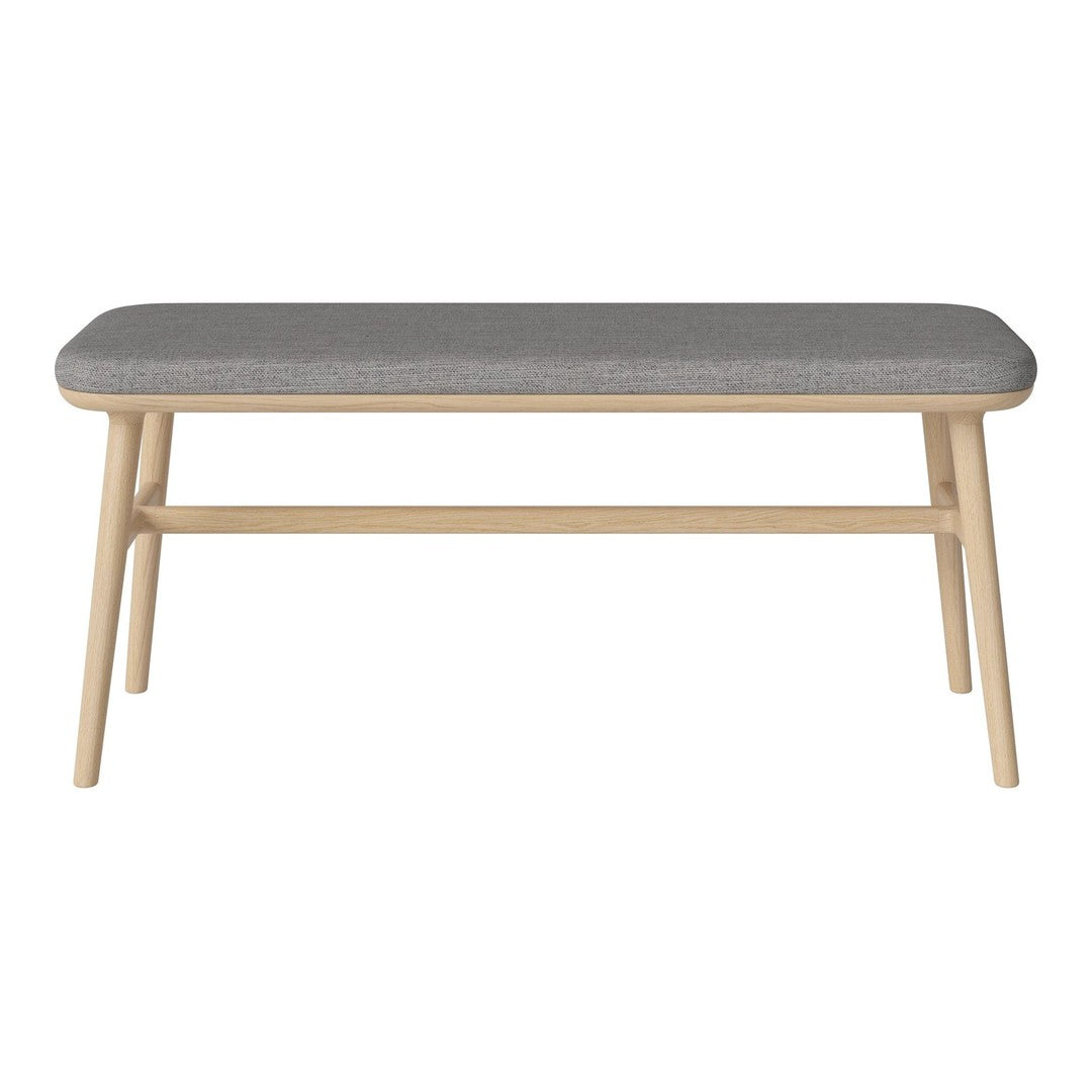 Gray upholstered bench with a light wood frame and minimalist design. Ideal for modern home decor.