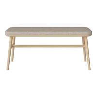 Neutral beige upholstered bench with light wooden legs, featuring a simple, modern design. Perfect for any decor.
