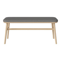 Light wood coffee table with a soft gray upholstered top and clean, simple lines. Perfect for modern decor.