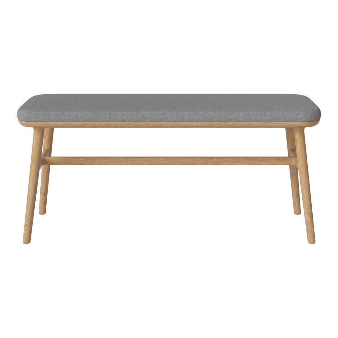 Gray upholstered bench with a natural wood frame, showcasing a minimalist design and smooth lines.