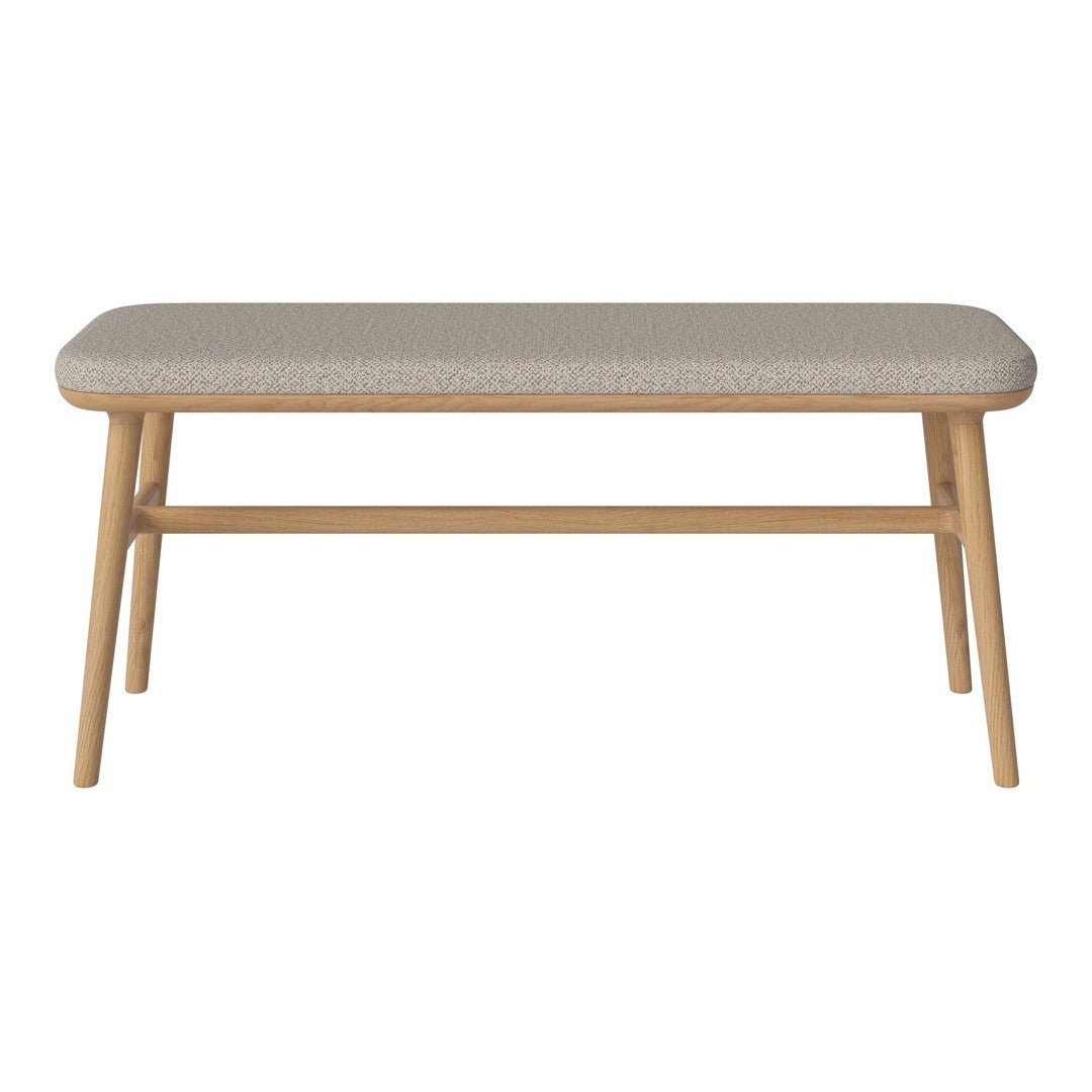 Beige upholstered bench with a minimalist design and natural wood legs, showcasing a subtle textured pattern.