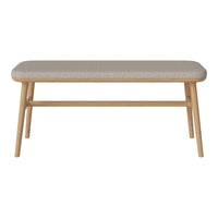 Beige upholstered bench with a minimalist design and natural wood legs, showcasing a subtle textured pattern.