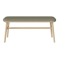 Light wood bench with a textured green upholstered top, featuring a simple and modern design.