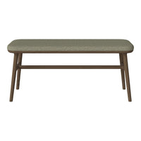 Brown wooden coffee table with a soft, textured green upholstered top. Simple design, perfect for modern decor.
