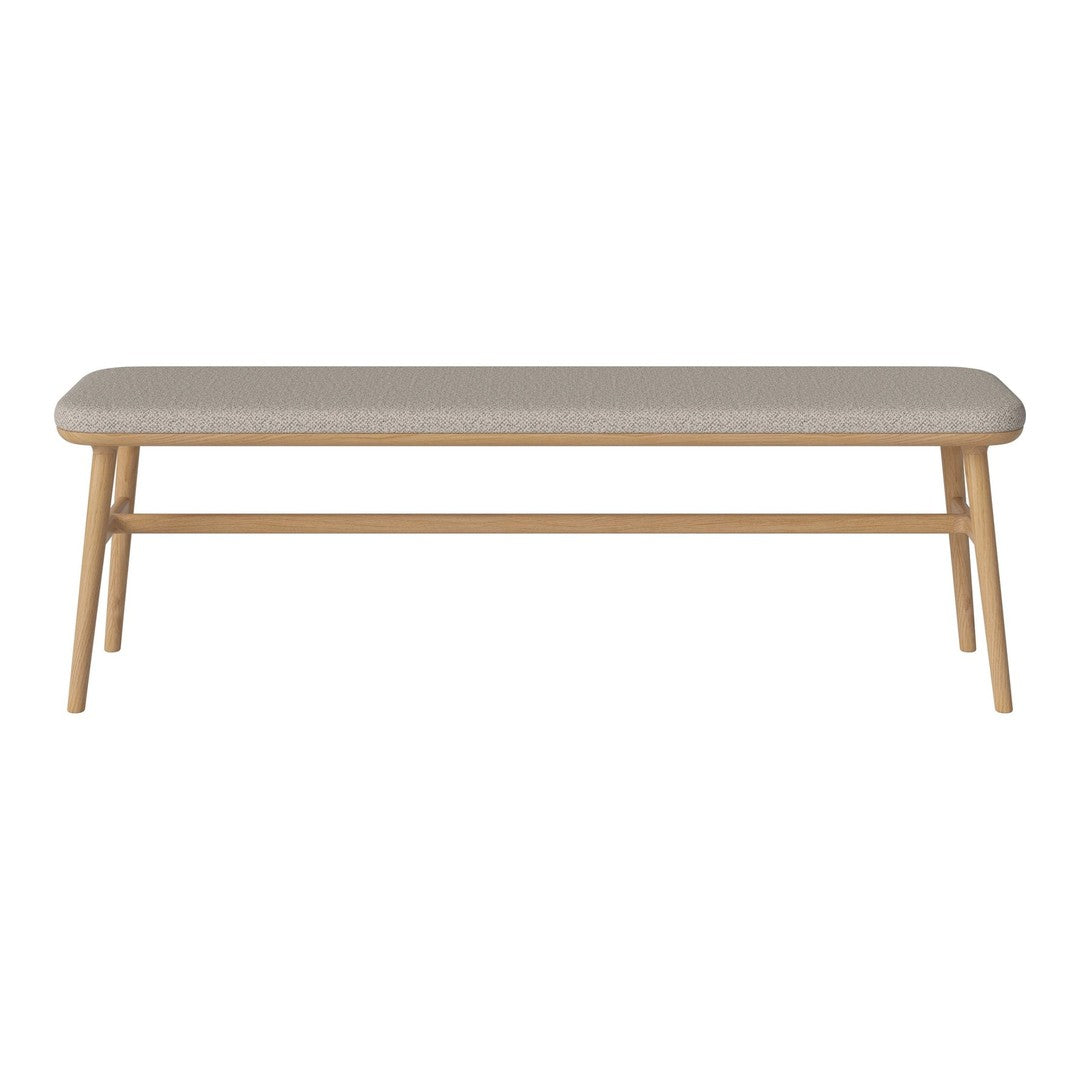 Light beige upholstered bench with natural wood legs, featuring a minimalist design and clean lines.