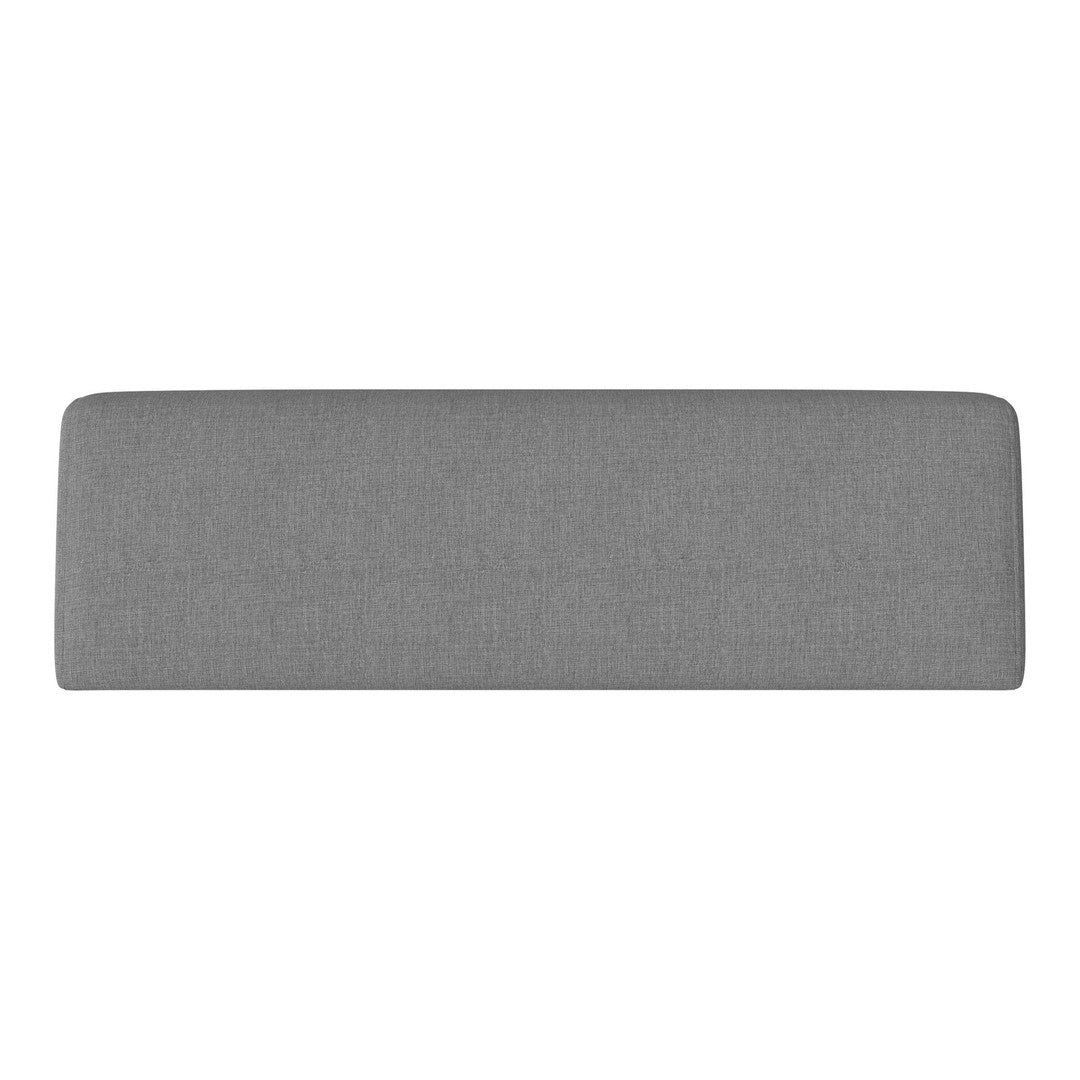 Gray upholstered headboard with a smooth, textured finish, adding a modern touch to any bedroom decor.