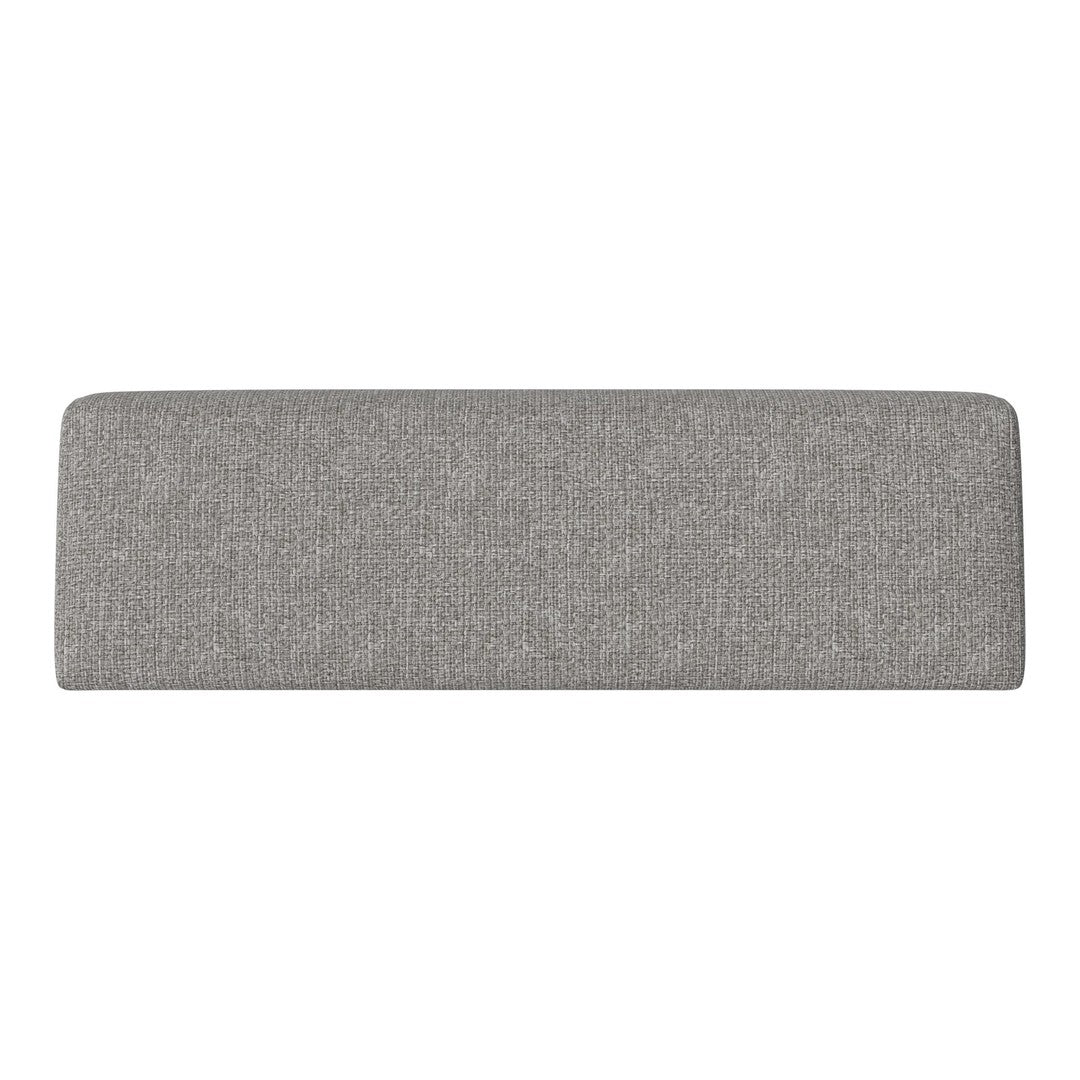 Gray upholstered bench with a subtle textured pattern, perfect for modern decor.