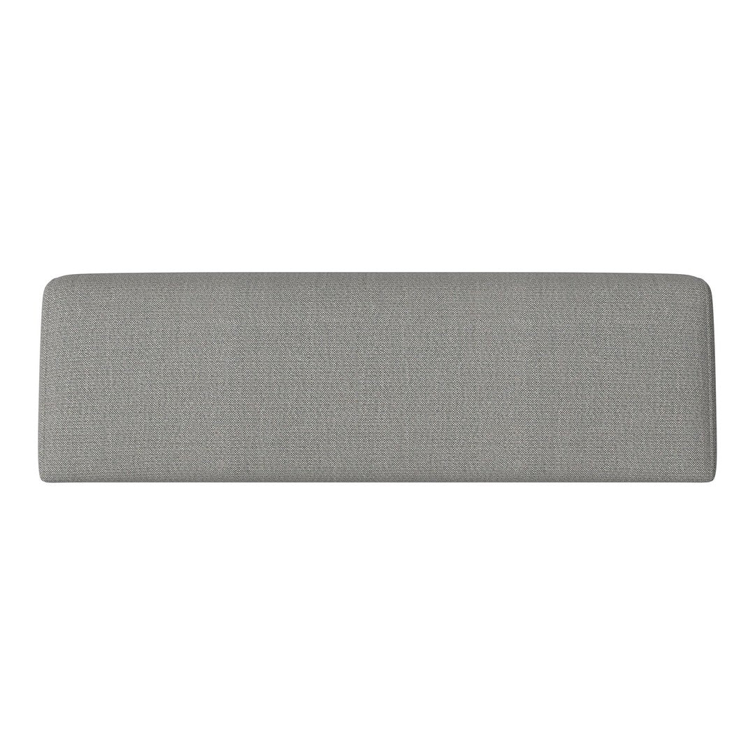 Gray upholstered headboard with a smooth, textured surface. Ideal for modern bedroom decor.