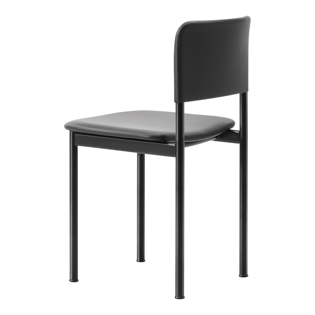 Black metal chair with a matte finish and smooth gray seat, showcasing a minimalist design.