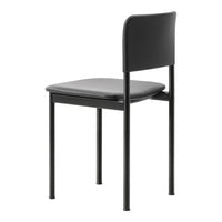 Black metal chair with a matte finish and smooth gray seat, showcasing a minimalist design.