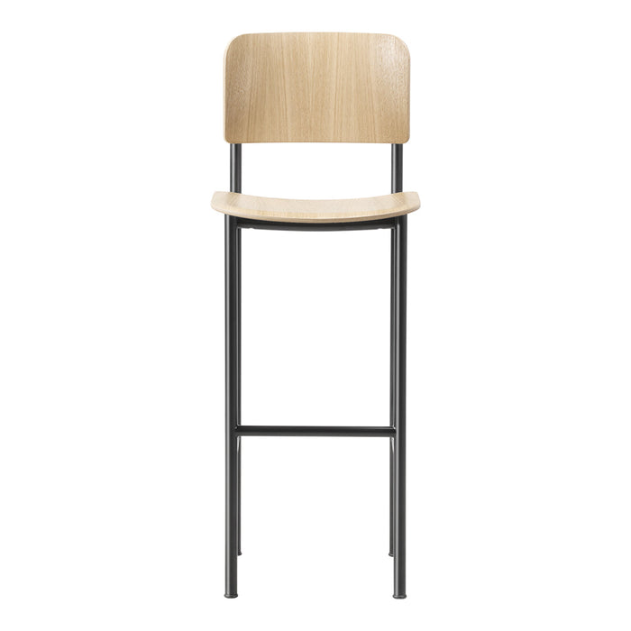 Natural wood and black metal bar stool with a minimalist design, highlighting smooth finishes and modern style.