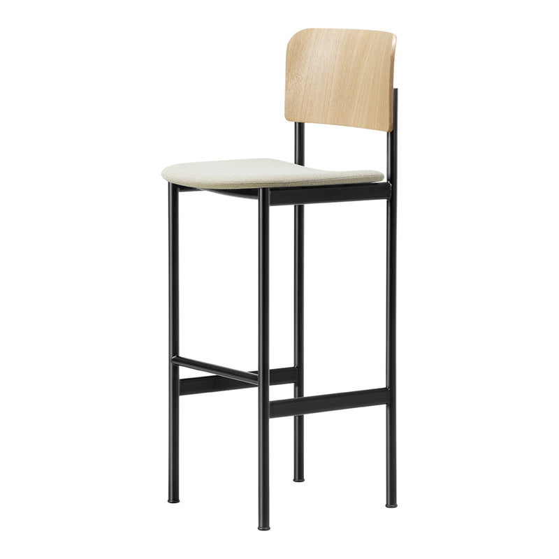 Minimalist black metal bar stool with light wood backrest and cream seat cushion, featuring clean lines and modern design.