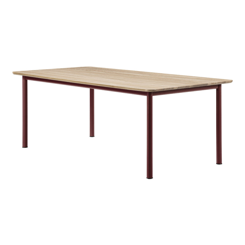 Natural wood tabletop with light beige finish and deep red metal legs, featuring a minimalistic and modern design.