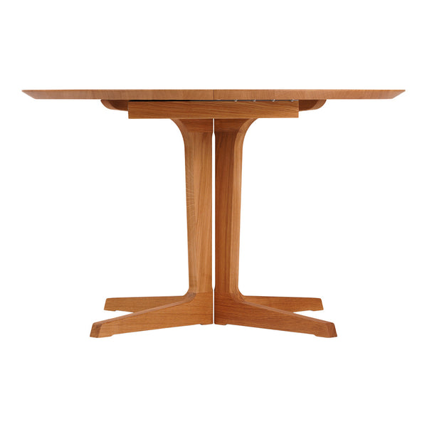Wooden dining table with a sleek, natural finish and a minimalist design featuring clean lines and sturdy legs.